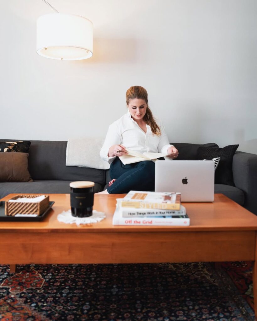 Kate sitting working on laptop